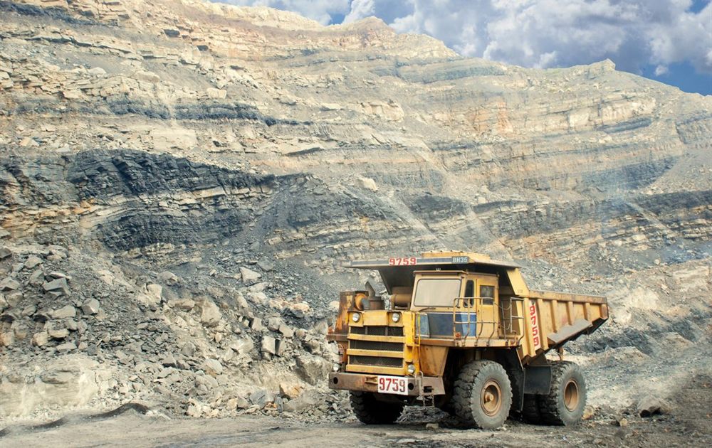 Heavy tipper truck at a quarry face